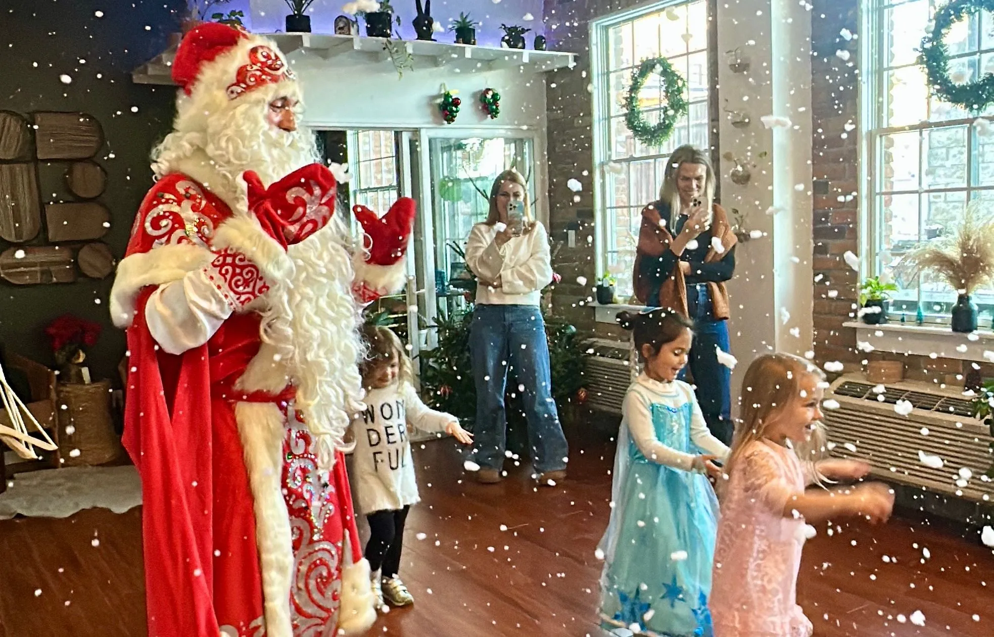 Santa Claus greeting children at a holiday party