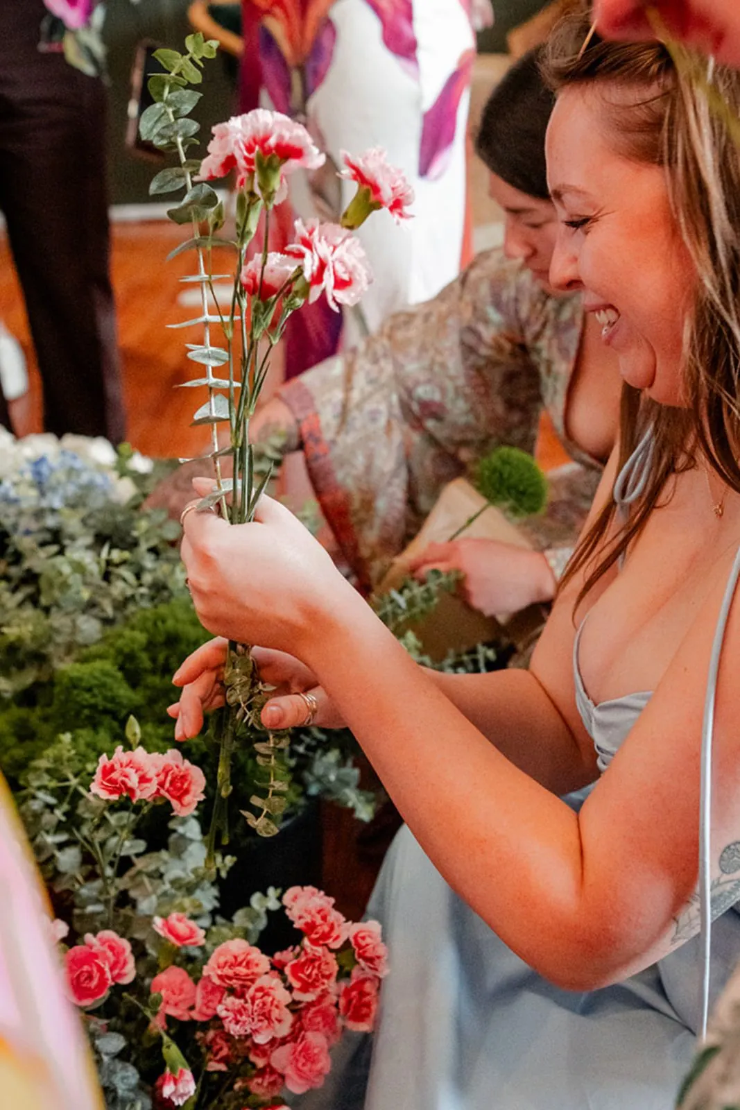 Guest smelling a bouquet of fresh flowers