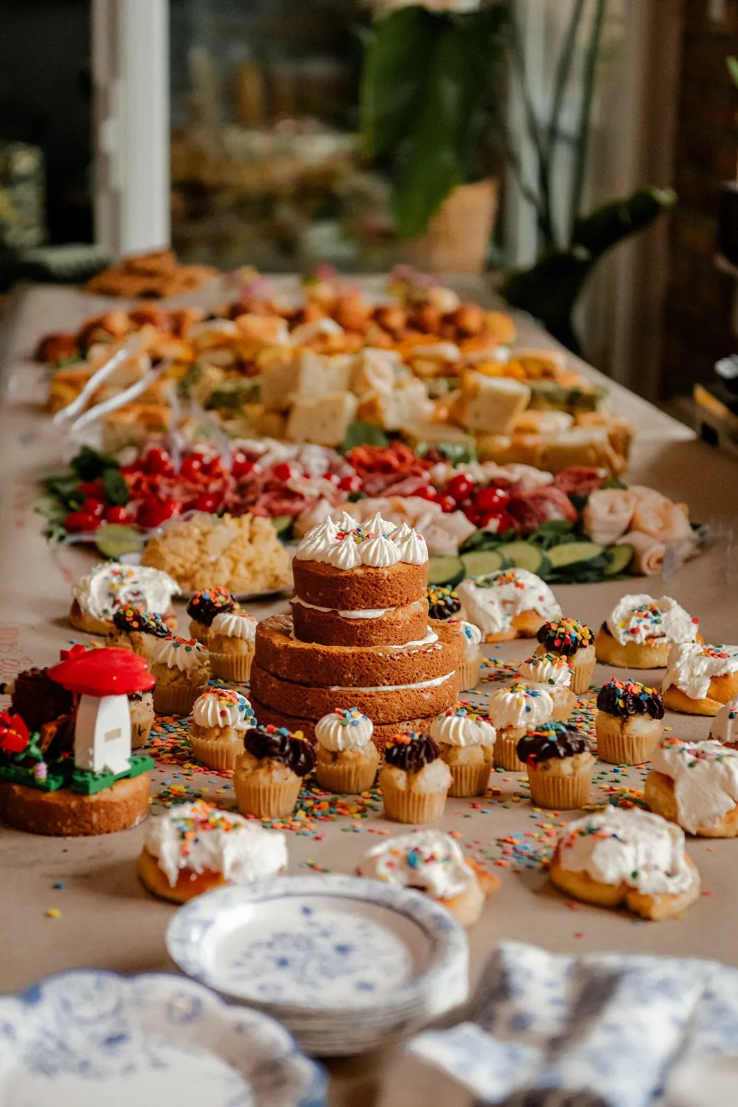 Wedding dessert table with cake, pastries and fruit