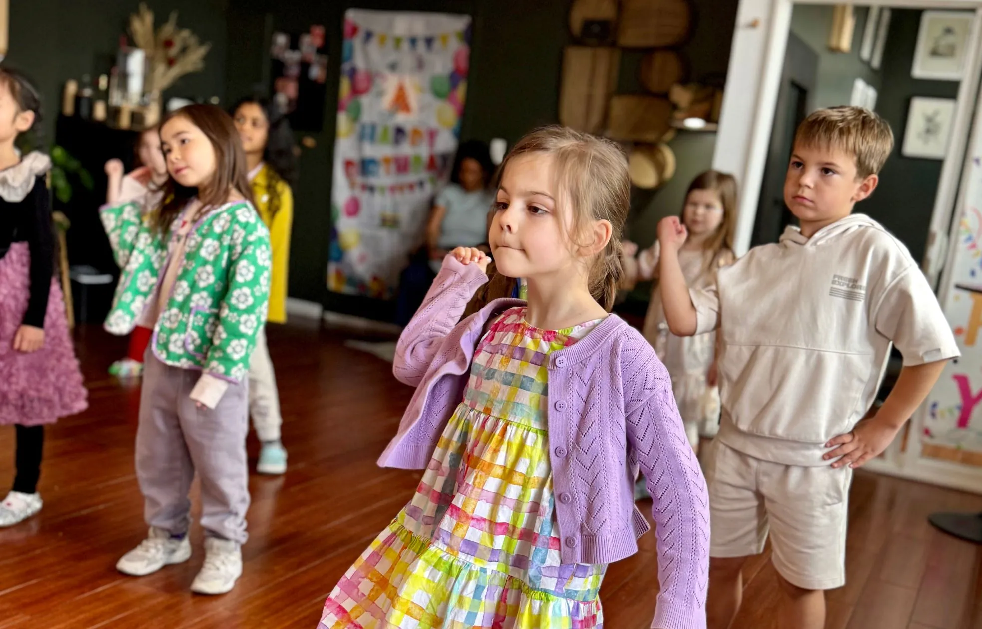 Children in costumes at a birthday party in the space