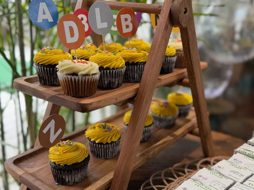 Cupcakes on a wooden stand with letter blocks