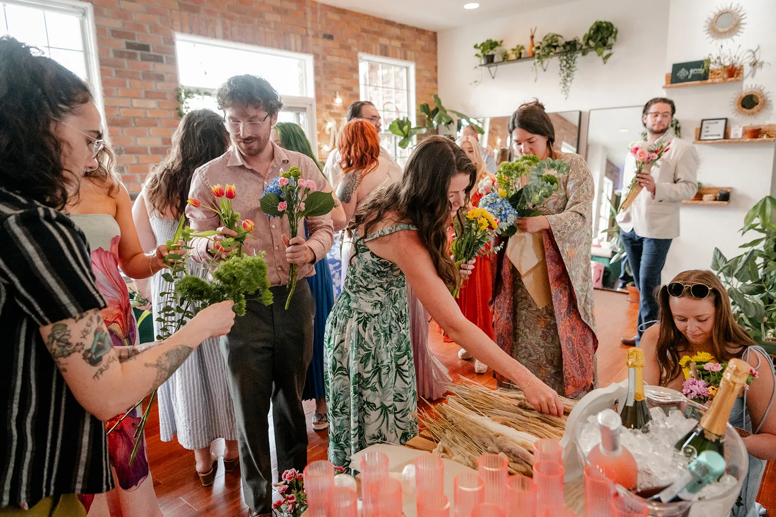 Guests making flower bouquets at a flower bar workshop