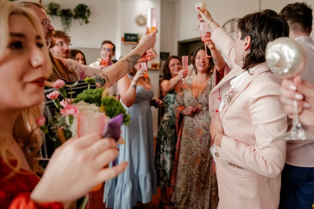 Guests toasting with flowers at a celebration