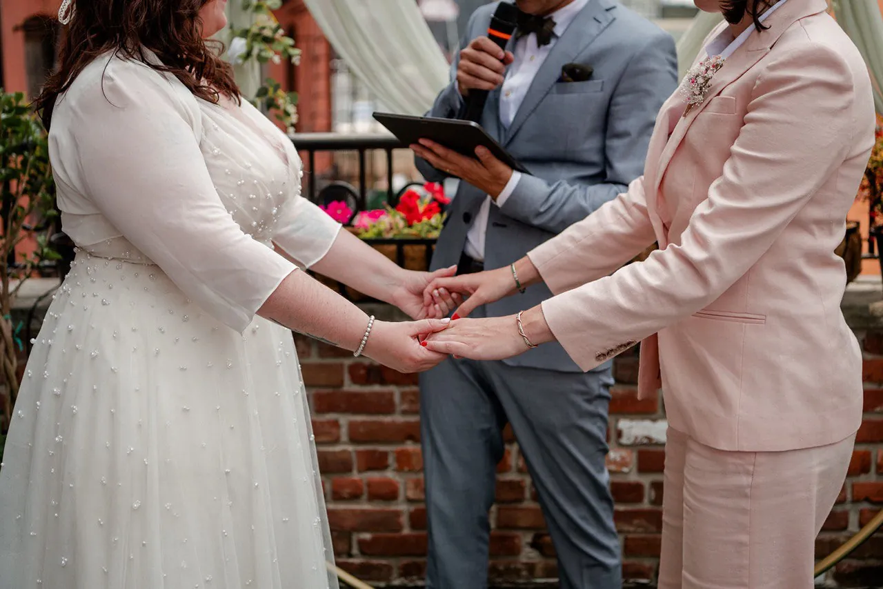 Couple holding hands during an elopement ceremony