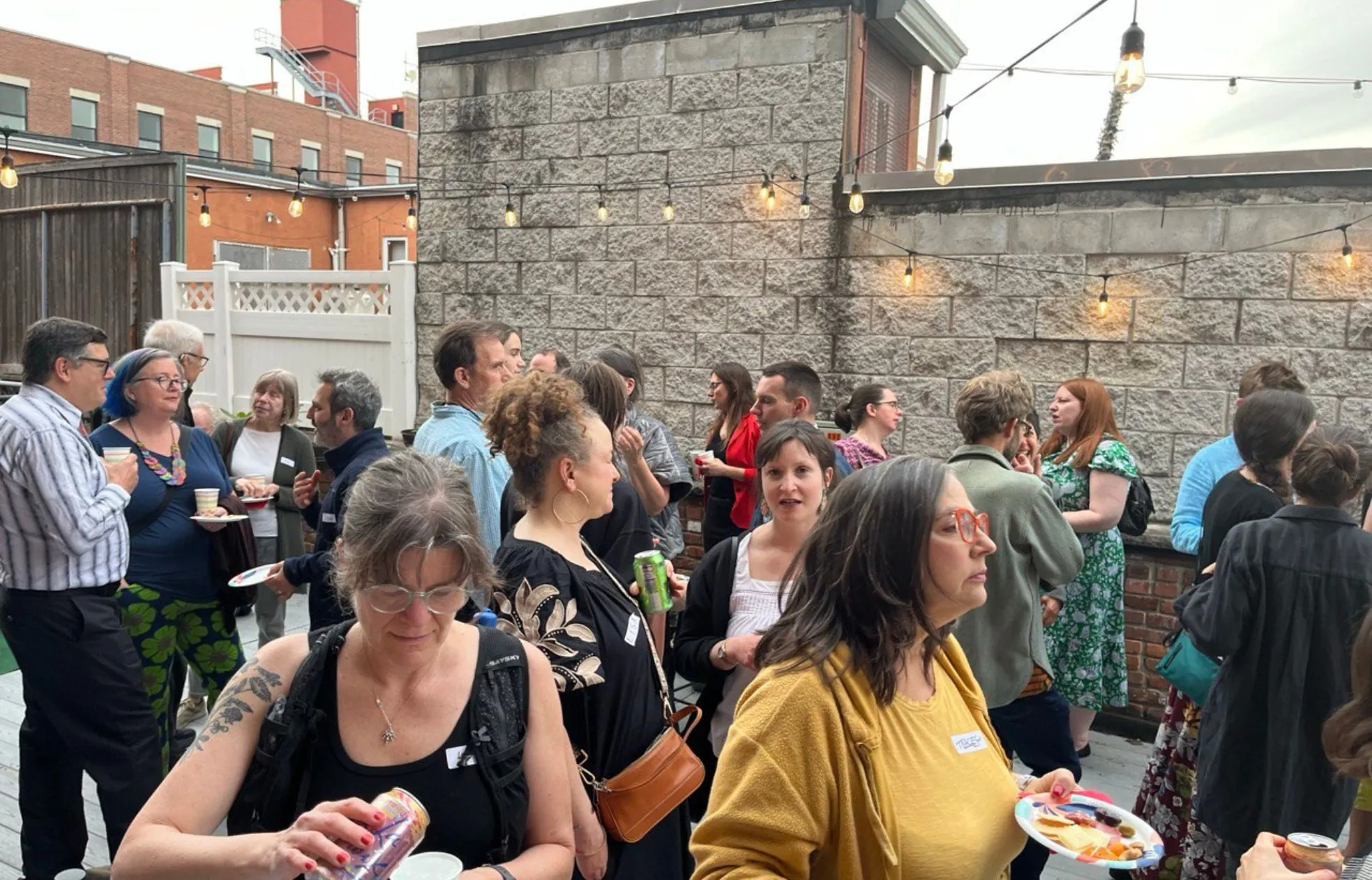 Crowd of guests at an event on the terrace