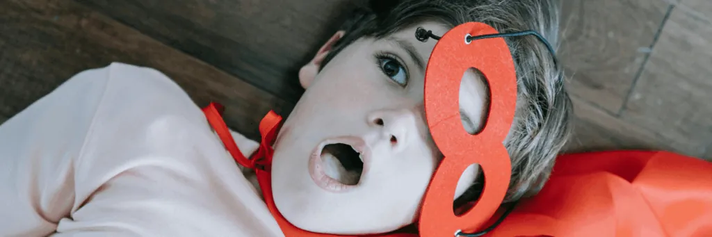 Child in a superhero mask (Superheroes theme)