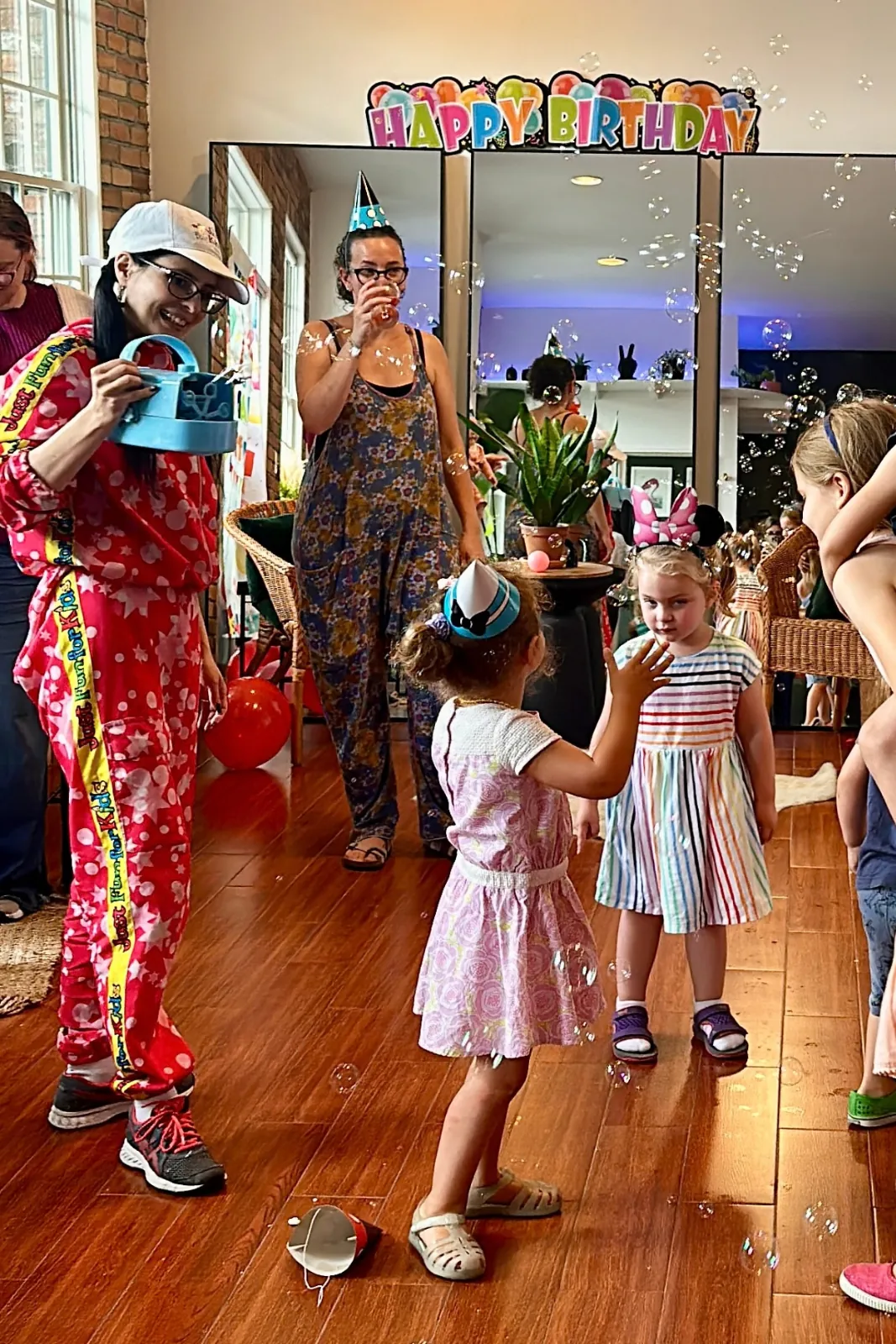 Kids and parents dancing at a birthday party