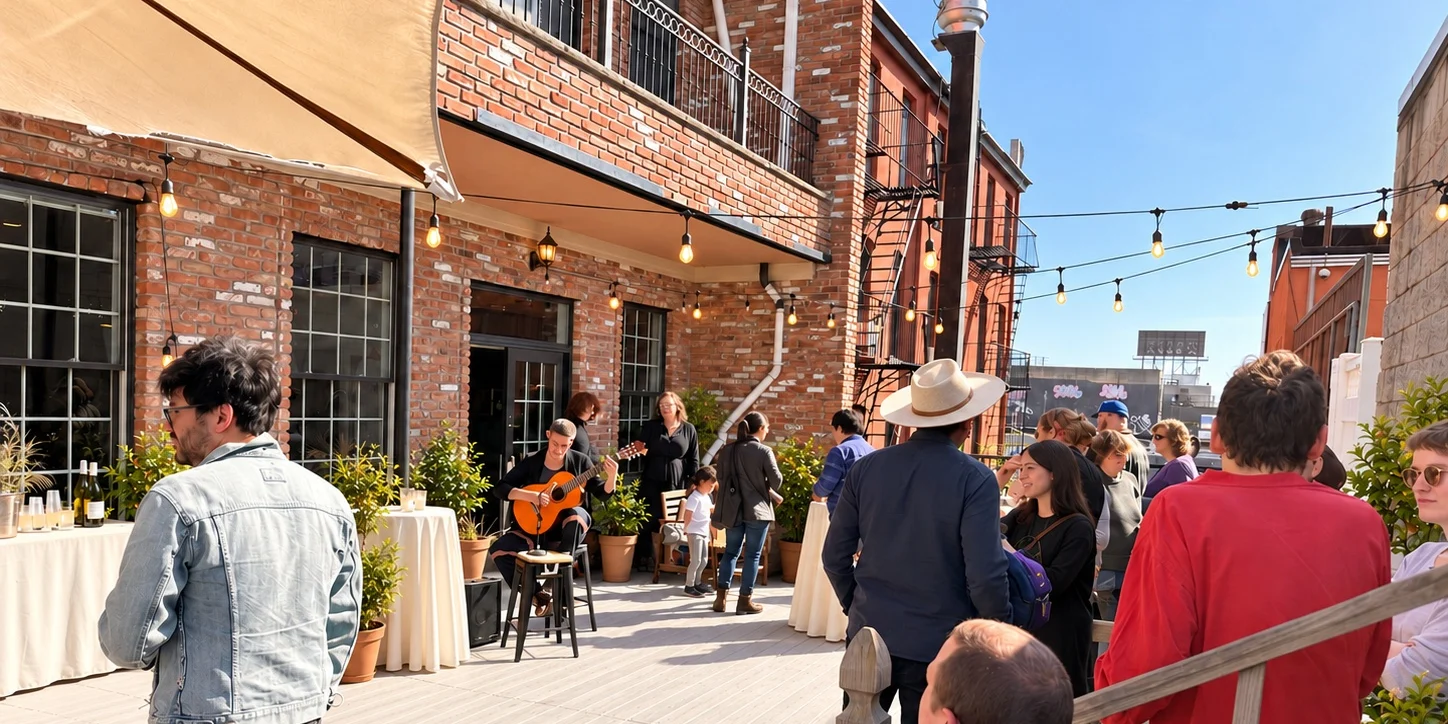 Guests gathered on the sunny Green Boutique terrace with string lights and live guitar