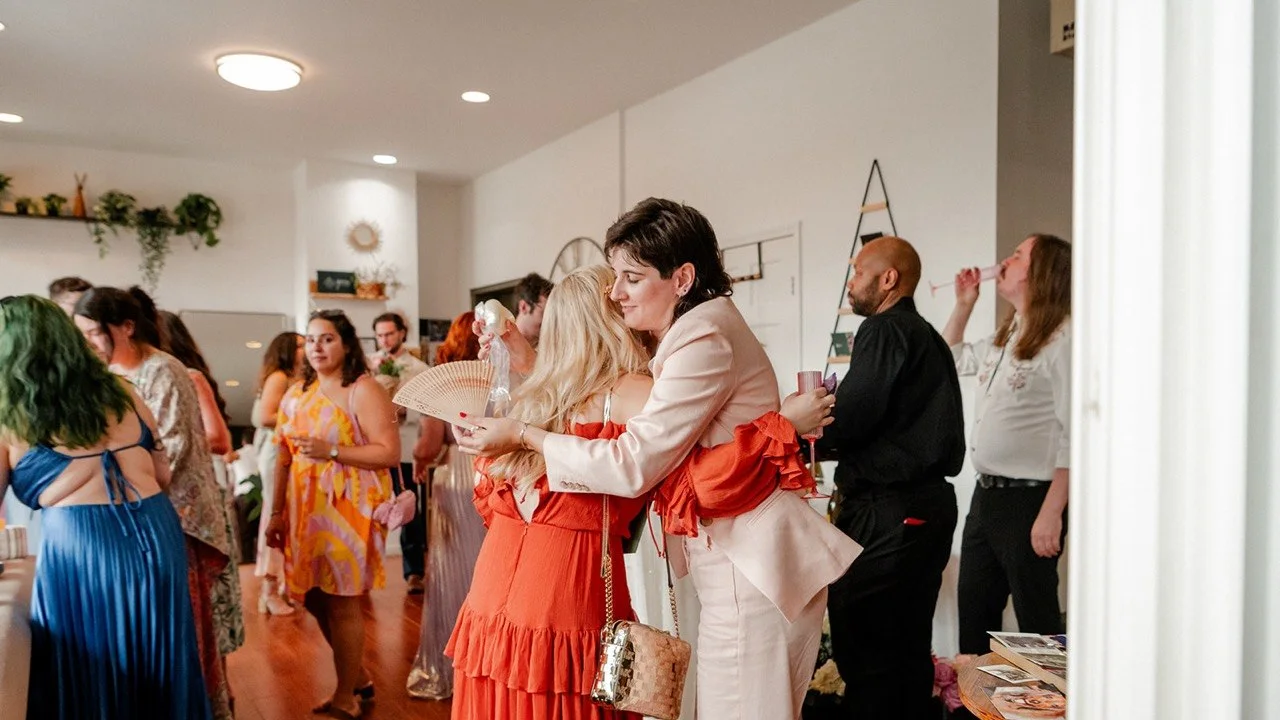 Wedding guests hugging and celebrating at Green Boutique